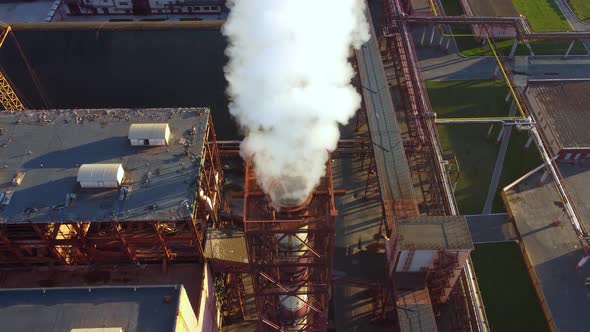 Aerial view of a plant pipes pollute atmosphere.