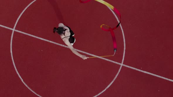 Young Woman Gymnast is Exercising