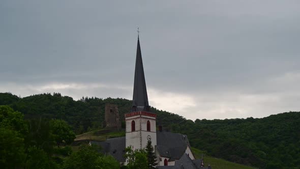 Time lapse of a thick cloud cover above a catholic church in Klotten, Germany.