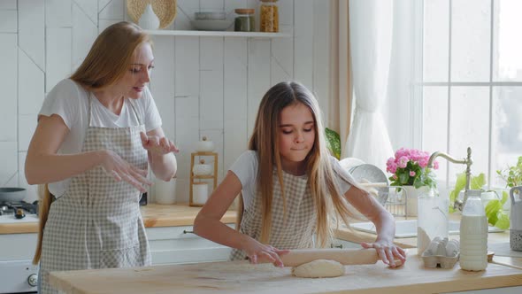 Caring Caucasian Mother Adult Woman Loving Mom Baker Teaches Little Teenage Girl Daughter to Cook