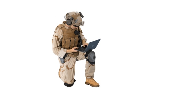 Soldier using laptop and Radio For Communication During