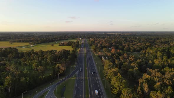 aerial footage of freeway interstate in georgia surrunded by forest and threes