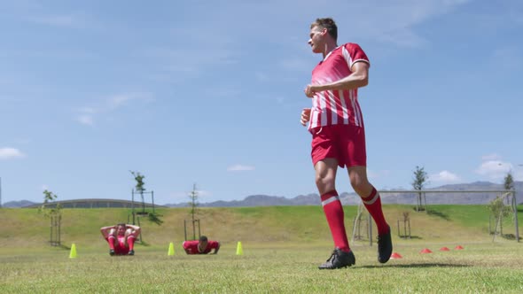 Soccer players training on field