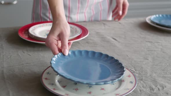 Christmas Table Decoration. Festive Table Setting. Female Hands Decorate the Table for Christmas