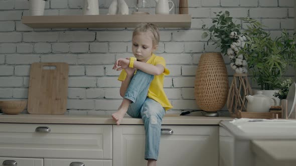 Blonde girl using her smart watch