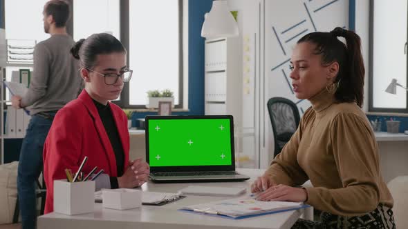 Team of Women Working with Green Screen on Laptop