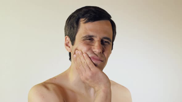 Young Man Having a Toothache