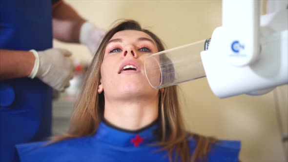 Dentist Does Xrays for a Young Girl to Determine the Patient's Future Treatment