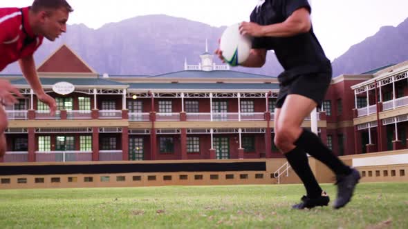 Male rugby players playing rugby in the stadium 4k