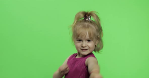 Girl in Purple Dress Dancing and Shows a Finger Forward. Chroma Key