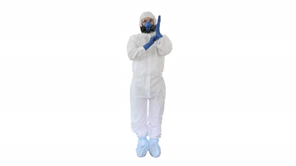 Man Wearing HAZMAT Protective Clothing Showing That He Wears Gloves on White Background