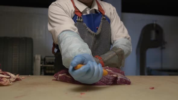 Male Hands Prepare Fresh Meat for Delivery to Stores