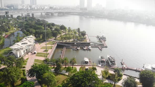 Shooting Aerial Unmanned Flight From Top View of the City Bridge with Cars and Motorbikes Against