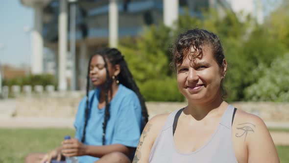 Static Shot of Happy Woman Smiling at Camera After Training