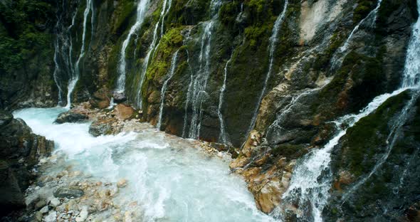 Waterfalls with Blue Ice Smelt Water in Wimbachklamm Gorge in Bavaria Germany