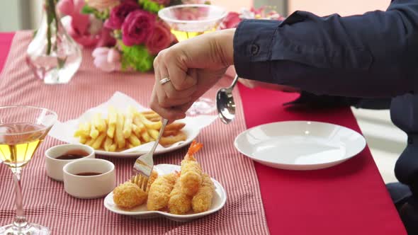 Happy Romantic Couple Eating Lunch at Restaurant