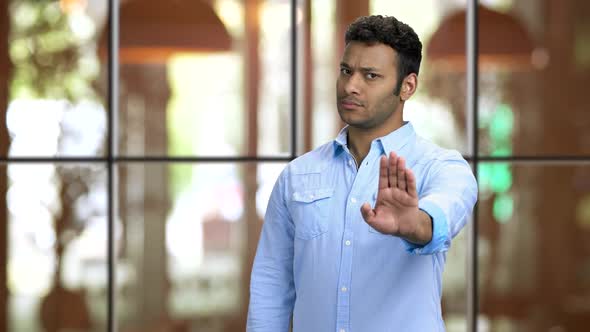 Young Brownskinned Man Showing Stop Gesture