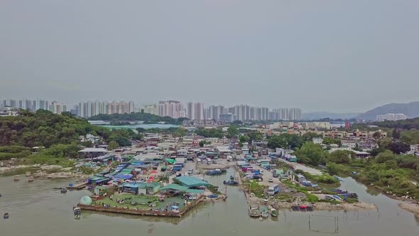 A dynamic tilting aerial footage of the fishing village in Lau Fau Shan in the New Territories of Ho