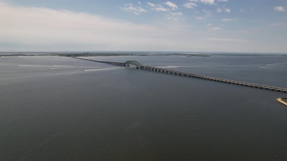 An aerial view of the Great South Bay Bridge on a beautiful morning. The drone camera dolly in towar