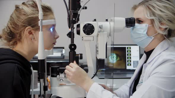 The Ophthalmologist Examines the Patient's Eye and Then Looks Into the Camera