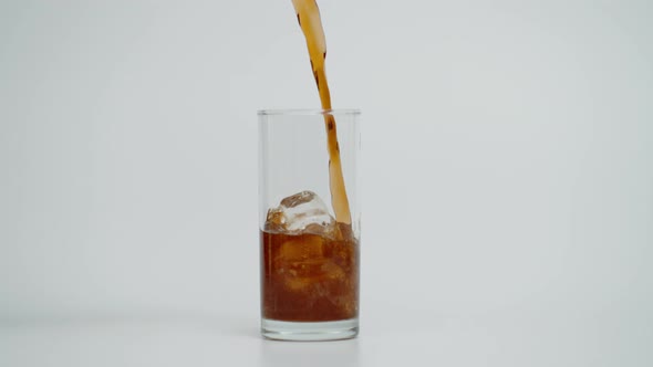 Super Slow Motion of Pouring Cola in Glass with Ice Shot at 1000 Fps