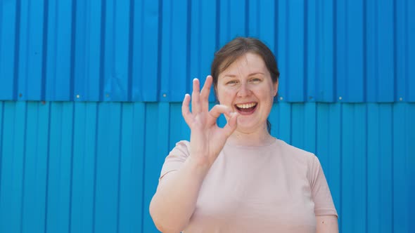 Simple Happy Woman Without Makeup Showing to Camera Symbol I Am Fine