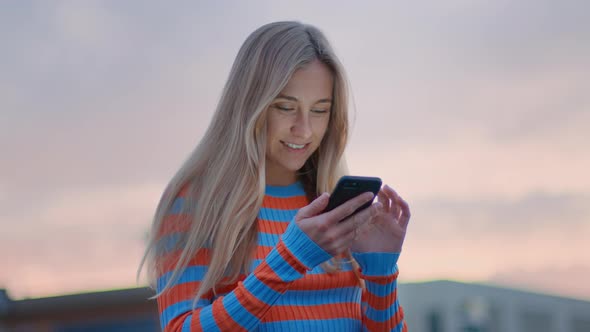 Young Millennial Woman Use Smartphone at Sunset