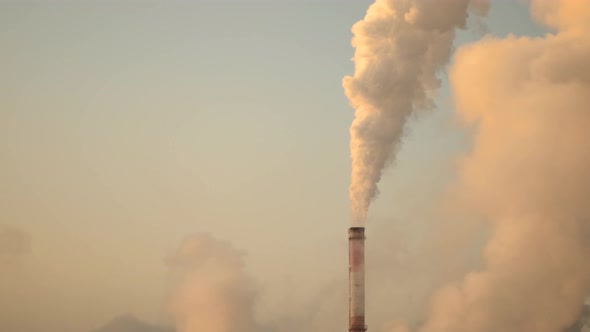 The Smog Spreads Into the Atmosphere From a Large Factory Pipe That Extends Into the Sky