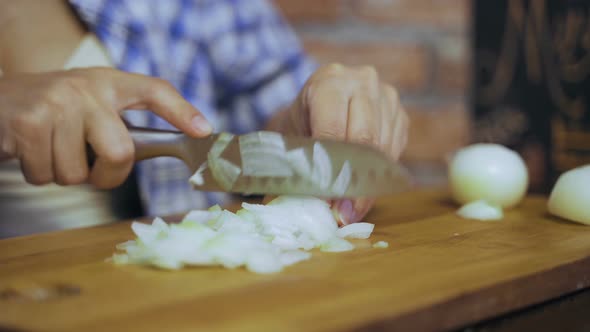 Pregnant woman at home in the kitchen cooks food