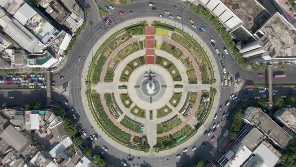 Descending aerial of a large roundabout street view traffic cars roads