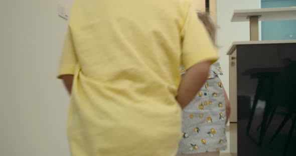 View From of Children's Brother and Sister Running to the Bedroom in Slow Motion