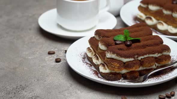 Classic Tiramisu Dessert, Cup of Coffee, Sugar and Milk on Concrete Background