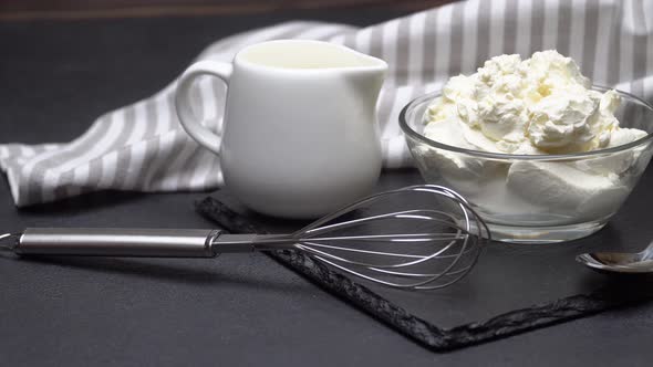 Traditional Mascarpone Cheese in Glass Bowl on Concrete Background