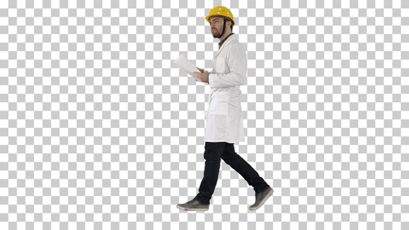 Engineer Manager Walking with Hard Hat Is Holding Paper