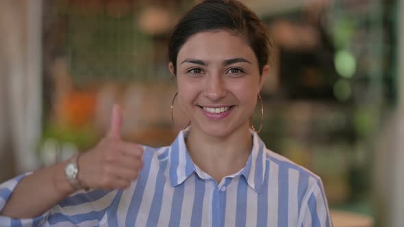 Positive Young Indian Woman Doing Thumbs Up 