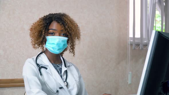 African American Student Intern with a Tablet in the Hospital