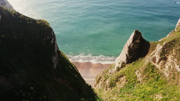 View From Above From the Top of a Cliff with Sharp Peaks to the Seashore