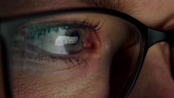 Woman in Glasses Looking on the Monitor and Surfing Internet