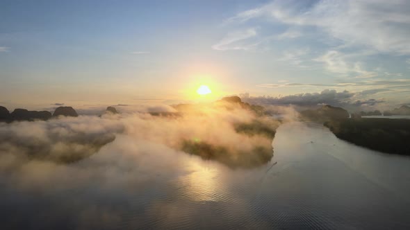 View of sunset or sunrise. Over river and misty cloud in river. Mountain and sky sunset background