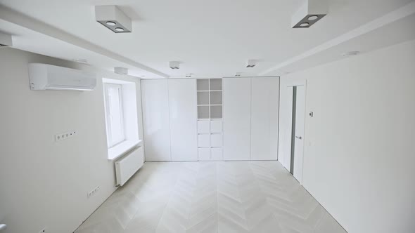 Empty White Room and Ceiling Light