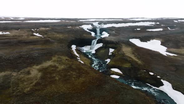 Aerial View on Hengifoss Waterfall with Red Stripes Sediments