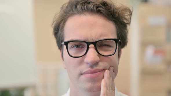 Face Close Up of Young Man Having Toothache