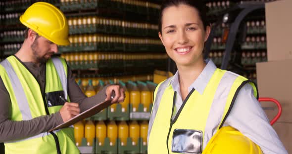 Portrait of female supervisor smiling in warehouse