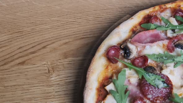 Appetizing Pizza on a Wooden Board in a Restaurant