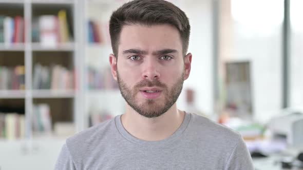 Portrait of Allergic Young Man Sneezing