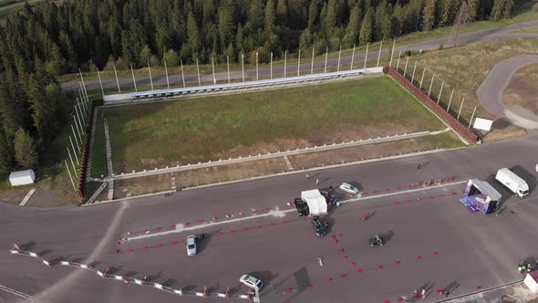 Biathlon training base in mountains with green pine trees forest