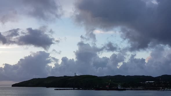 Dramatic clouds moving in the sky over a beautiful coast in Batanes, Philippines.