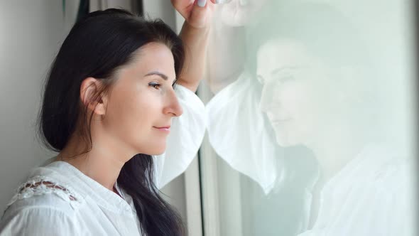 Relaxed Morning Girl During Watching Through Transparent Glass From Indoor Feeling Calm Closeup