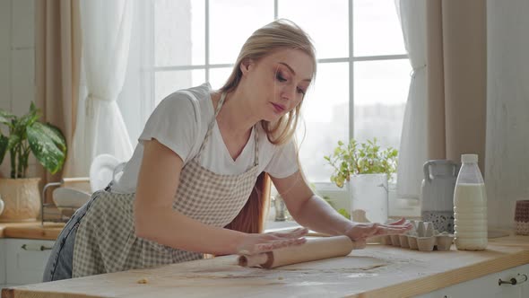 Tired Woman Adult Lady Baker Chef Housewife Caucasian Blonde Mom in Apron Using Rolling Pin