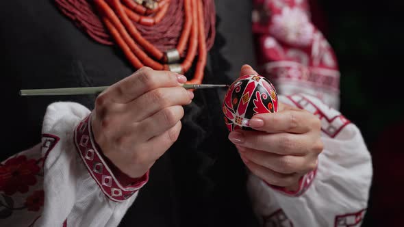 Ukrainian Woman Painting Traditional Ornamets on Easter Egg  Pysanka